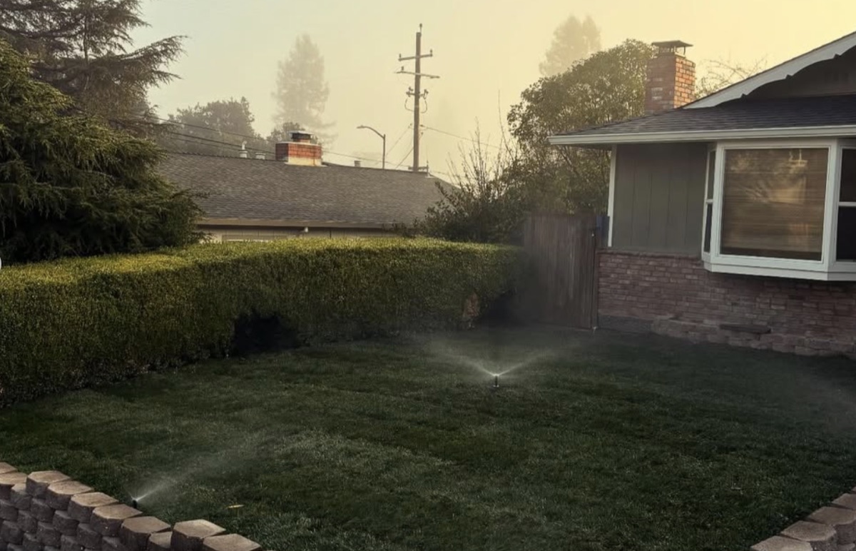 Working lawn sprinkler system at a residential property